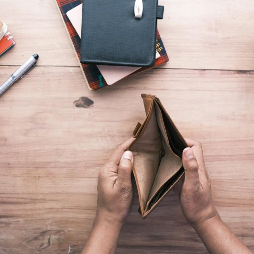person holding an empty wallet