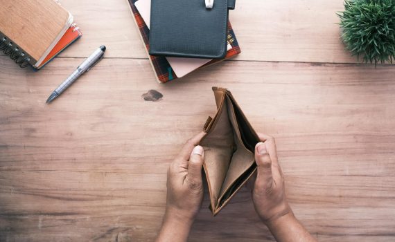 person holding an empty wallet