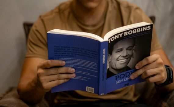 motivational book in hands of man